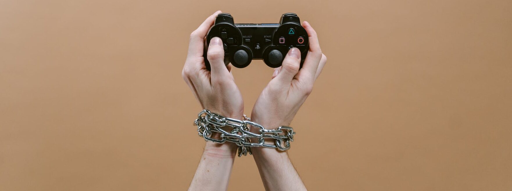 close up shot of a person holding a game controller